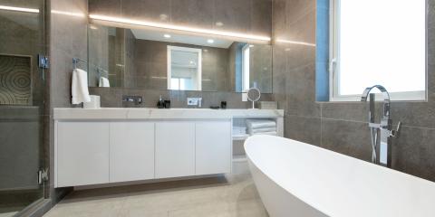 The image shows a modern bathroom interior that is well-lit and spacious