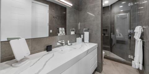 The image shows a modern bathroom with a sleek and elegant design
