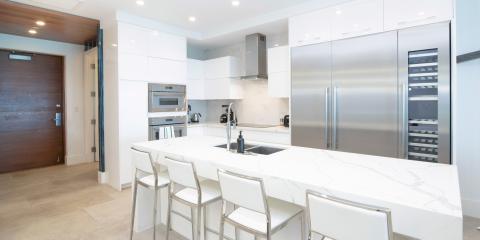 The image shows a modern kitchen featuring a minimalist design