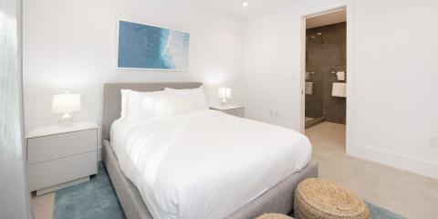 The image shows a modern, well-lit bedroom