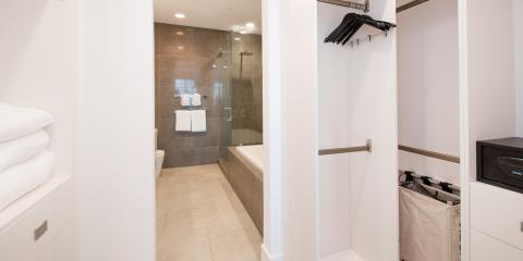 The image shows part of a modern bathroom and closet area