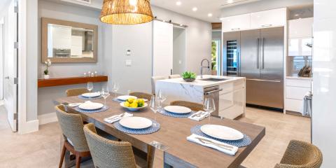 This image displays a modern kitchen and dining area