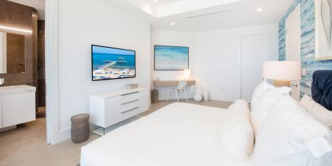 This image features a modern, bright bedroom