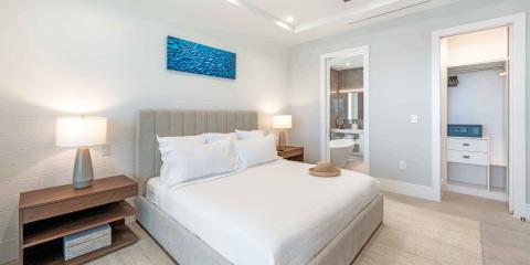 This image shows a contemporary bedroom with a minimalist design