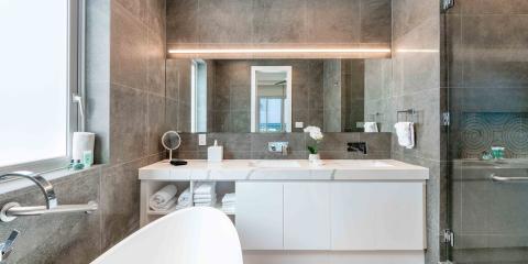 This image shows a modern and spacious bathroom