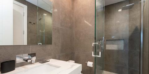 This image shows a modern bathroom featuring sleek, contemporary design elements