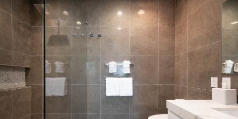 This image shows a modern, luxurious bathroom interior