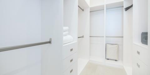 This image shows a modern, organized walk-in closet