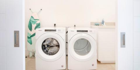 This image shows a well-organized laundry room equipped with modern appliances