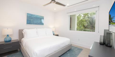 This is an image of a modern and tidy bedroom