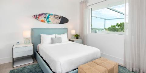 This image shows a modern and bright bedroom