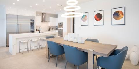 The image shows a modern, well-lit kitchen and dining area