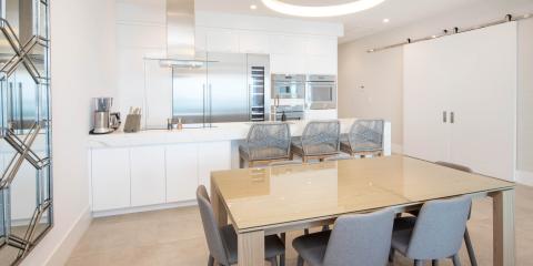 This image depicts a modern kitchen and dining area