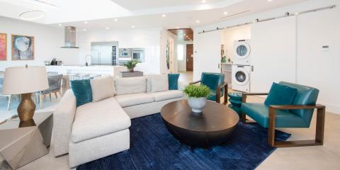 This image features a modern, open-plan interior space, primarily styled with contemporary furniture and decor