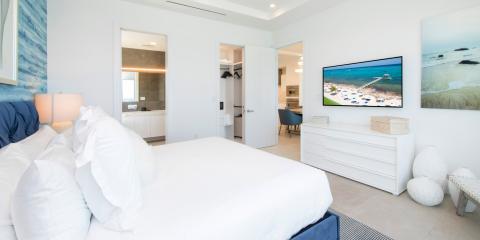 This image shows a modern and well-lit bedroom