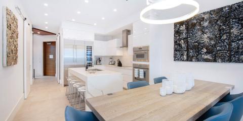 This image shows a modern kitchen and dining area