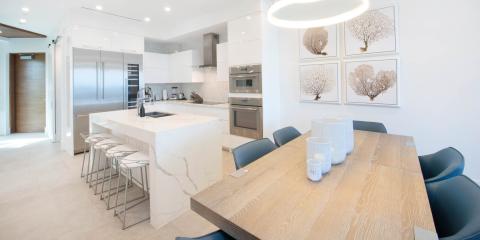 This image shows a modern kitchen and dining area