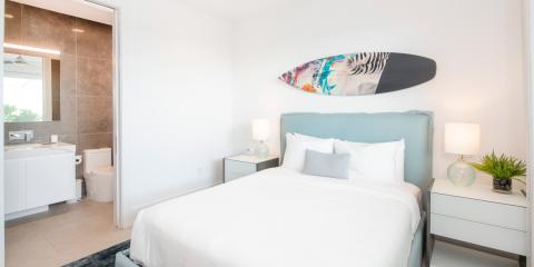 The image shows a modern bedroom interconnected with a bathroom