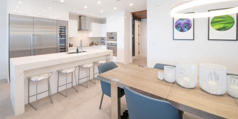 The image shows a modern kitchen and dining area