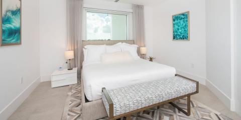The image shows a modern, well-lit bedroom