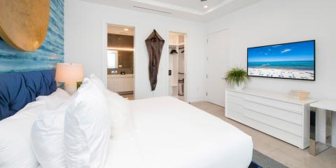 The image shows a stylish bedroom with a contemporary design