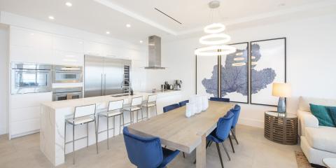 This image depicts a modern kitchen and dining area