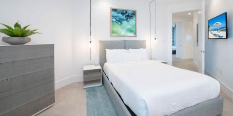 This image features a modern and neatly arranged bedroom