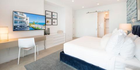 This image features a modern and well-lit bedroom