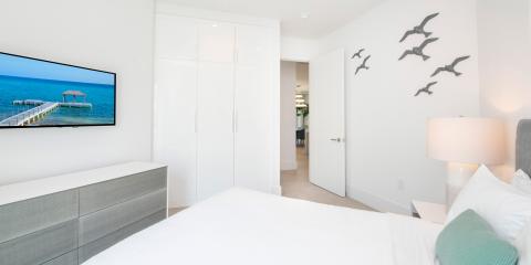 This image shows a modern and bright bedroom