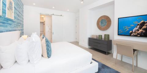 This image shows a modern and neatly decorated bedroom