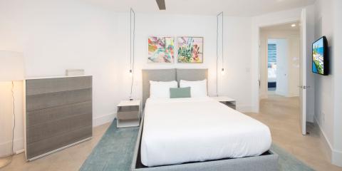 This image shows a modern and well-decorated bedroom
