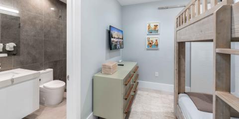 This image shows a modern bathroom setup that includes a space-saving feature