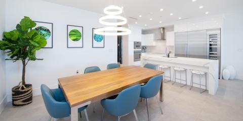 This image shows a modern kitchen and dining area