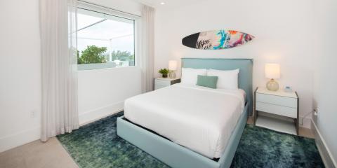 This is an image of a modern and well-lit bedroom