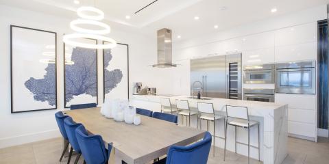 The image showcases a modern, stylish kitchen with an integrated dining area