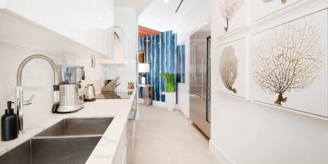 This image depicts a modern, well-lit kitchen with sleek and stylish design elements