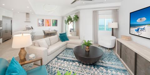 This image shows a modern, stylish interior of a beachfront house