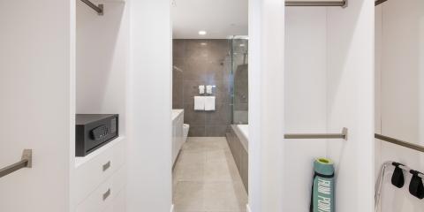 This image shows a modern bathroom and adjacent storage area