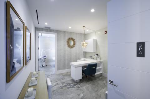This image shows a modern spa interior with a stylish and clean design