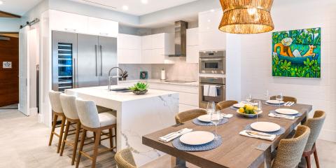 This image shows a modern kitchen and dining area