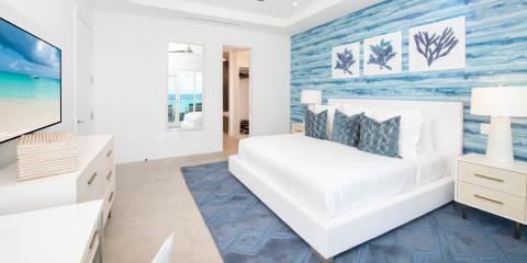 This image shows a modern bedroom with an ocean-inspired theme