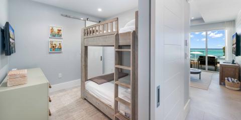 This image shows a neatly arranged bedroom with a minimalistic and modern design