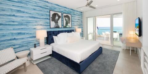 This image shows a modern and stylish bedroom with a coastal theme