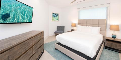 The image depicts a modern and neatly arranged bedroom