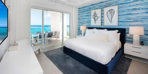 The image shows a luxurious bedroom with a contemporary design