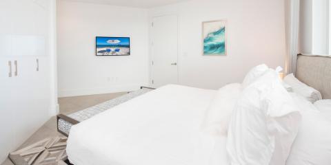 This image shows a modern and well-lit bedroom