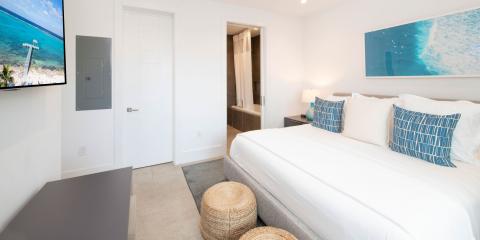 This image shows a modern, brightly lit bedroom