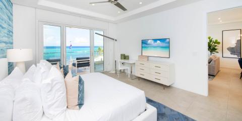 This is an image of a bright and airy beachfront bedroom