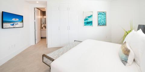 The image shows a modern, well-lit bedroom