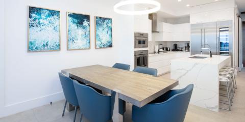 This image displays a modern kitchen and dining area
